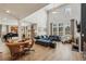 Open-concept living space with large windows, a grand piano, and comfortable seating arrangement at 4257 Freight St, Tucker, GA 30084