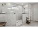Walk-in shower with a glass partition and dual showerheads at 4257 Freight St, Tucker, GA 30084