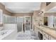 Luxurious bathroom with a soaking tub, shower and double vanity at 1037 Windermere Xing, Cumming, GA 30041
