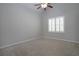 Neutral bedroom with a vaulted ceiling, a ceiling fan, and a window with white shutters at 1037 Windermere Xing, Cumming, GA 30041