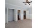 Neutral bedroom with closet and access to other rooms in the home at 1037 Windermere Xing, Cumming, GA 30041