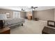 Spacious bedroom with carpet flooring, ceiling fans, and natural light at 1037 Windermere Xing, Cumming, GA 30041