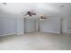 Expansive bedroom featuring neutral carpet, ceiling fans, and crown molding at 1037 Windermere Xing, Cumming, GA 30041