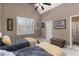 Bedroom with two twin beds, vaulted ceiling, and a large window with white shutters at 1037 Windermere Xing, Cumming, GA 30041