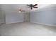 Open bedroom with ceiling fans, neutral walls, and carpet flooring at 1037 Windermere Xing, Cumming, GA 30041