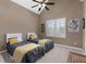 Bedroom featuring two twin beds, vaulted ceiling, and a large window with white shutters at 1037 Windermere Xing, Cumming, GA 30041