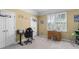 Inviting, carpeted room with natural light, desk, and neutral wall color, ideal for a recreational room or bedroom at 1037 Windermere Xing, Cumming, GA 30041