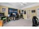 Fun bonus room featuring carpet, ceiling fan, and decorated game decor at 1037 Windermere Xing, Cumming, GA 30041