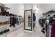 Spacious walk-in closet with built-in shelving and a mirror at 1037 Windermere Xing, Cumming, GA 30041