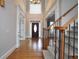 Inviting foyer with hardwood floors, staircase, and entry door, offering a grand welcome at 1037 Windermere Xing, Cumming, GA 30041