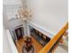 Open foyer with hardwood floors, chandelier, and staircase access to the upper level at 1037 Windermere Xing, Cumming, GA 30041