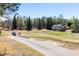Picturesque view of a golf course with lush green fairways and trees in a beautiful setting at 1037 Windermere Xing, Cumming, GA 30041