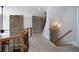 Hallway features a stone accent wall and staircase with wooden railings at 1037 Windermere Xing, Cumming, GA 30041