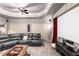 Large home theater room with projector screen, comfortable seating, and custom cabinets at 1037 Windermere Xing, Cumming, GA 30041