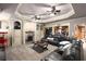 Spacious home theater featuring a large screen, comfortable leather seating, and stylish decor at 1037 Windermere Xing, Cumming, GA 30041