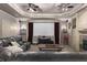 Cozy home theater features plush seating, projector screen and ceiling fan lighting at 1037 Windermere Xing, Cumming, GA 30041