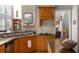Well-appointed kitchen with granite countertops, custom cabinetry, and a gas cooktop at 1037 Windermere Xing, Cumming, GA 30041