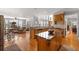 Open-concept kitchen with an island, stainless steel appliances, and eat-in area at 1037 Windermere Xing, Cumming, GA 30041