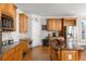 Beautiful kitchen with stainless steel appliances, custom cabinetry, and a granite island at 1037 Windermere Xing, Cumming, GA 30041