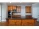 Well-equipped kitchen with custom wood cabinetry, a center island, and stainless steel appliances at 1037 Windermere Xing, Cumming, GA 30041