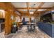 Unique living room with wood paneled walls, a large aquarium, bar seating, and home theater at 1037 Windermere Xing, Cumming, GA 30041