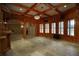Living room with wood paneling, wood ceiling, and beautiful tile floor at 1037 Windermere Xing, Cumming, GA 30041