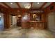 Fully paneled room with recessed lights, a service bar and tile flooring at 1037 Windermere Xing, Cumming, GA 30041