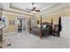 Light-filled main bedroom featuring a fireplace, access to a private balcony, and sitting area at 1037 Windermere Xing, Cumming, GA 30041