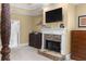 Main bedroom featuring fireplace with stone surround, TV, and neutral color palette at 1037 Windermere Xing, Cumming, GA 30041