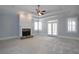 The main bedroom offers a cozy stone fireplace, trey ceiling and an abundance of natural light at 1037 Windermere Xing, Cumming, GA 30041