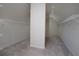 Spacious walk-in closet with carpet flooring and wire shelving for ample storage at 1037 Windermere Xing, Cumming, GA 30041