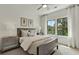 Comfortable bedroom with natural light, stylish furnishings, and serene outdoor views at 1283 Forsyth Park Rd, Decatur, GA 30033