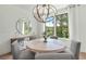 Bright dining room features modern lighting, wood floors, and scenic window view at 1283 Forsyth Park Rd, Decatur, GA 30033