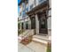 Inviting townhome entrances featuring brick stairs, elegant railings, and well-maintained landscaping at 1283 Forsyth Park Rd, Decatur, GA 30033