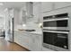 Modern kitchen featuring white cabinets, stainless steel appliances, and quartz countertops at 1283 Forsyth Park Rd, Decatur, GA 30033
