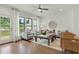 Cozy living room with natural light, modern furniture, and a view of the outdoor deck at 1283 Forsyth Park Rd, Decatur, GA 30033