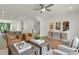 Open-concept living room with hardwood floors, modern decor, and seamless flow to the kitchen at 1283 Forsyth Park Rd, Decatur, GA 30033