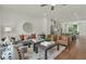 Spacious living room with modern furniture, hardwood floors, and an open layout to the kitchen at 1283 Forsyth Park Rd, Decatur, GA 30033