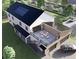 Aerial view of the stylish home with solar panels and a deck above the two-car garage at 2650 Roswell Rd, Marietta, GA 30062