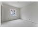 Bright bedroom featuring a large window with a view to the outside and ample natural light during construction at 2650 Roswell Rd, Marietta, GA 30062