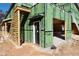 Construction of a two-story home with a framed porch and green exterior sheathing at 2650 Roswell Rd, Marietta, GA 30062