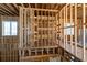 Framing of the staircase and future rooms highlights the layout of this multi-level new home under construction at 2650 Roswell Rd, Marietta, GA 30062