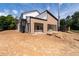 Side view showcasing the home's modern architecture, attached garage and outdoor staircase during construction at 2650 Roswell Rd, Marietta, GA 30062