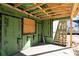 View of garage under construction with wooden beams, ZIP System and stairs leading to a back door at 2650 Roswell Rd, Marietta, GA 30062