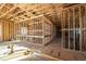 Interior view showcasing framing, flooring and wall construction in an unfinished new home at 2650 Roswell Rd, Marietta, GA 30062