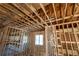 Unfinished room with exposed beams and ductwork, showing construction of a new home's interior at 2650 Roswell Rd, Marietta, GA 30062