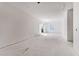 Spacious living room with large windows and sliding door, offering ample natural light during construction at 2650 Roswell Rd, Marietta, GA 30062