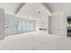 Spacious living room with a tray ceiling and large windows overlooking the yard at 2650 Roswell Rd, Marietta, GA 30062