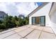 Upstairs patio featuring sliding glass doors providing seamless indoor-outdoor living during construction at 2650 Roswell Rd, Marietta, GA 30062