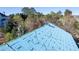 The roof construction with installers on top of the partially completed roof at 2650 Roswell Rd, Marietta, GA 30062